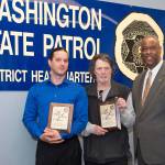 Honored for their lifesaving efforts were Shon McLead, left, and Peter Tabor. They received awards last week from Washington State Patrol Chief John Batiste. Photo courtesy of WSP