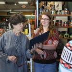 Hornet Kaylee Sines tanks her mentor, Debbie Veltung, at Work Sports and More. Photo by Ray Still