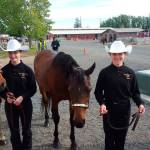 EHS equestrians Trinity Forristall and Nikole Schroeder leads their horses during the state competition in Moses Lake. Contributed photo