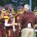 Coach Jeff Zenisek offers some direction to his offense during a game last year. Included was quarterback T.J. Stroschein, who is back as a starter in his sophomore season. File photo by Kevin Hanson