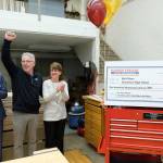 Enumclaw High School construction and architecture teacher Bob Kilmer, center, reacts after he was surprised with the news he and his school won the $100,000 Harbor Freight Tools for Schools Prize for Teaching Excellence, at Enumclaw High School on Thursday Oct. 26, 2017. Photo by Stephen Brashear