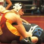 White Rivers Nate Belcourt battles his Bonney Lake opponent during a meet last week in the Hornet gym. Photo by Kevin Hanson