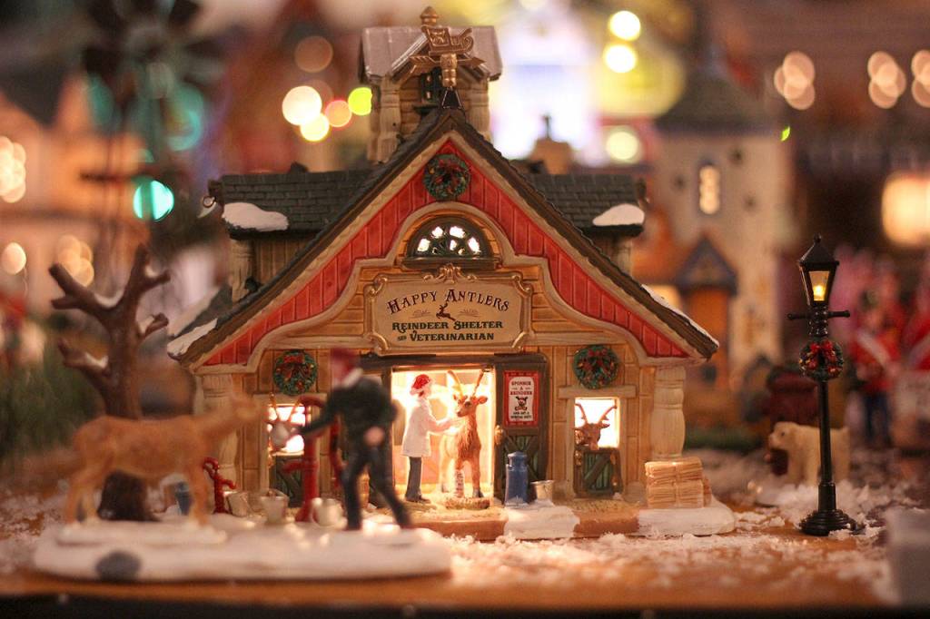 Some of the houses for the village are sentimental, like ones given to the Fountaines by friends and family who have died. Others represent parts of the Plateau, and still more  like the reindeer veterinarian office  are just plain cute and funny. Photo by Ray Still