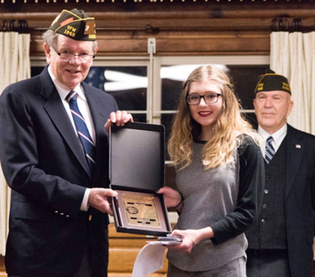 Keyera Huyler receiving her award.