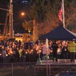 Despite the threat of rain and wind, hundreds turned out at Allan Yorke Park and lit candles in memory of the deceased. Photo by Ray Still