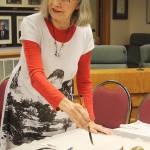 Artist Darlene Dihel explained the art of sumi painting and gave a demonstration during an open house April 6 in Gallery 2018. KEVIN HANSON PHOTO