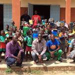 WITLI Village Director Adama Ouedraogo, center, with students and staff of Rialo Evangelic, the one school in the village. Submitted photo
