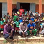 WITLI Village Director Adama Ouedraogo, center, with students and staff of Rialo Evangelic, the one school in the village. Submitted photo