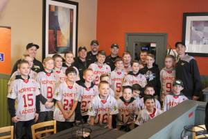 The Bonney Lake Police Department met up and thanked the Lake Tapps Hornets lacrosse team for taking a knee when a police procession passed their practice field in March. Photo by Ray Still