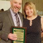 Sumner Highs Jeff Baines was joined by his wife, Marguerite, after accepting the states Athletic Director of the Year Award. Submitted photo