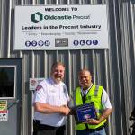 East Pierce Fire & Rescue, Fire Chief Bud Backer thanks John Marticio of Oldcastle Precast for their donations and support. Submitted photo