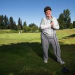 91-year-old golfer Bette Moore stands along on the 14th hole at Walter Hall Golf Course in Everett on Tuesday. Moore recently hit a hole-in-one on the hole. (Andy Bronson / The Herald)