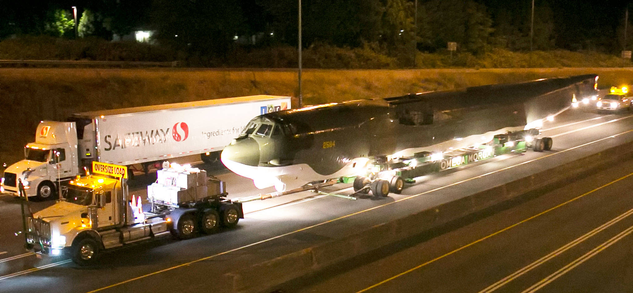 The B-52 Midnight Express is towed along I-405 while en route from Paine Field in Everett to the Museum of Flight at Boeing Field in Seattle early Sunday morning. (Kevin Clark / The Herald)