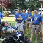 Members of the TransAmerica team are greeted by Gilbert, 18, who has welcomed the cycling team to Enumclaws Ashley House for the last seven years. Ray Miller-Still photo.
