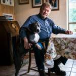 Charles Pillon and his trusty dog Chiba at his residence east of Renton. Photo by Caean Couto