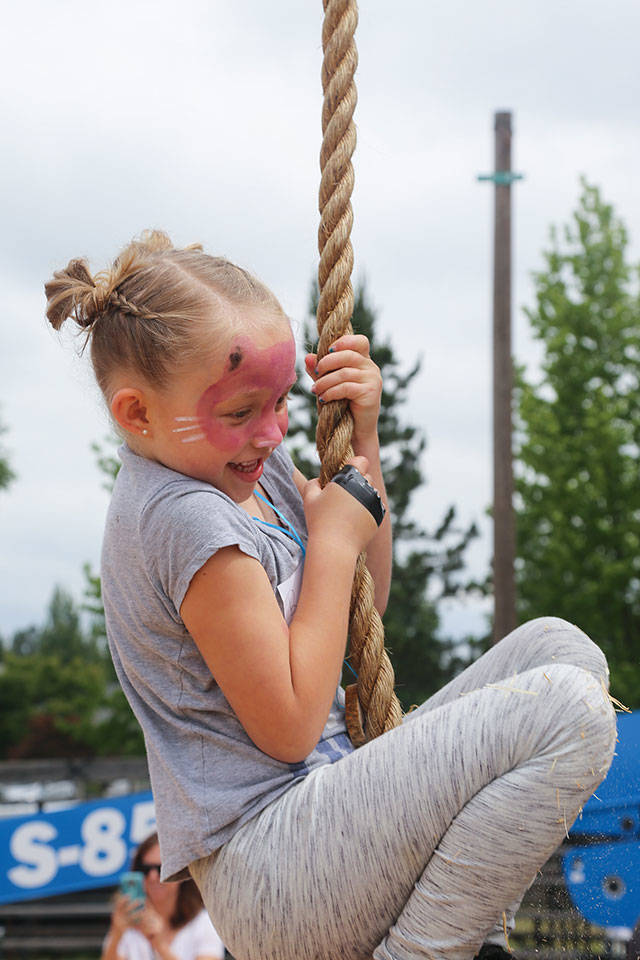 Reese Huizenga in the rope climb. Photo by Ashley Britschgi