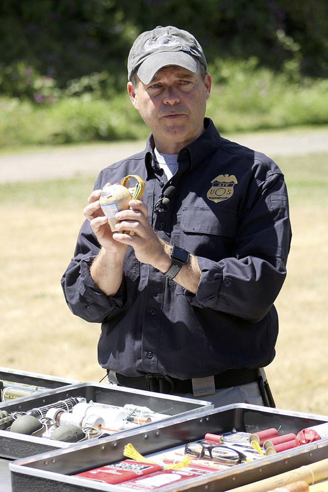 Brennan Phillips shows off a legal three-inch Arial Salute firework. Used professionally, it has great effects during an Independence Day firework display; used by consumers, it can lead to lost limbs and even death. Photo by Ray Still