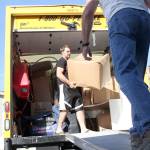 Marty McFadden wrangled some help from the Enumclaw Church of Latter Day Saints to help him and his family unpack the moving truck, which came all the way from South Jordan, Utah to Black Diamond. Photo by Ray Still