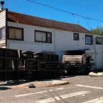 Dump truck crashes into Alderton store