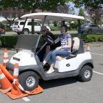 The Enumclaw and Black Diamond Police Departments helped teach all 222 Enumclaw High School seniors the dangers of driving impaired. Students tried to navigate an obstacle course of traffic cones in a golf cart while wearing goggles that simulated being drunk or high on marijuana, or had to dry and complete the course while having a live texting discussion with a friend on the sidelines. At the end of the event, Courier-Herald intern Tiani Grosso took a shot at the course. Photo by Ray Still