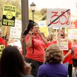 Gabrielle Wright, president of the Sumner Education Association and english teacher at Bonney Lake High School, led a picket group of teachers, bus drivers and nutrition workers who are demanding the Sumner-Bonney Lake School District give them large percentage wage increases, or face a strike. Photo by Ray Miller-Still
