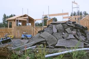 Hardhats and heavy equipment continue to dot school grounds