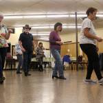 Enumclaw seniors dance along with their new line dance instructor, Sharon Elston, who was just teaching them the Cupid Shuffle. Photo by Ray Miller-Still                                Enumclaw seniors dance along with their new line dance instructor, Sharon Elston, who was just teaching them the Cupid Shuffle. Photo by Ray Miller-Still