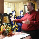 Tody Hanson, grand master of Washingtons Odd Fellows and a member of the Buckley lodge, shows one of the displays in the local museum. Most of the items are from lodges that have disbanded, like the banner from tiny Dixie, Washington. PHOTOS BY KEVIN HANSON