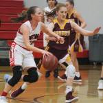 Hornet sophomore Kara Marecle applies defensive pressure against her Orting opponent on Dec. 14. Photo by Kevin Hanson