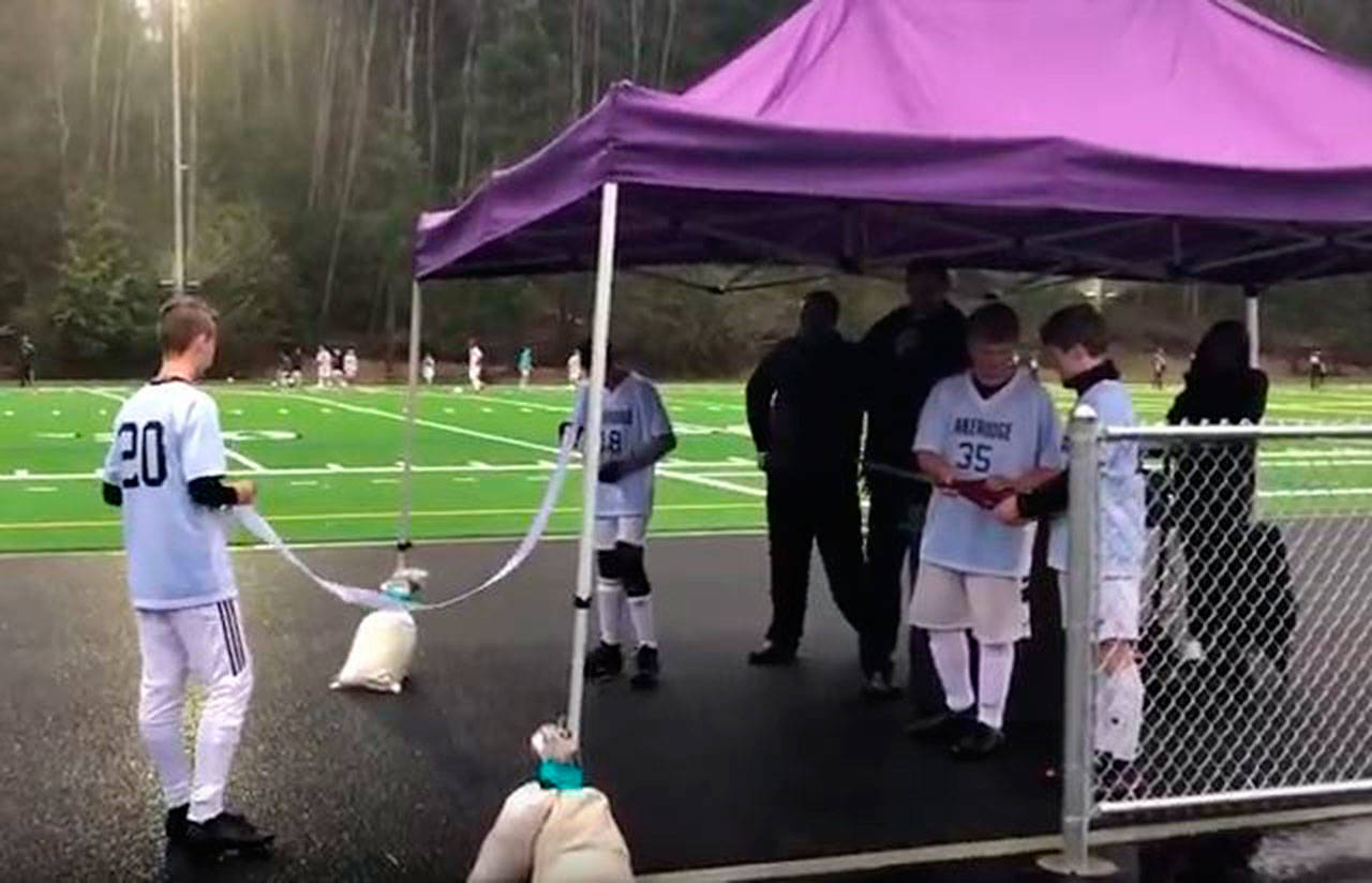 Students participated in the Dec. 11 ribbon-cutting during torrential rain, proving the new field was, indeed, all-weather. Submitted photo