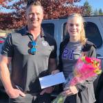 Hannah Weymiller received a $1,000 scholarship Saturday from Luke Guthrie, owner of Prime Ops Security. Submitted photo