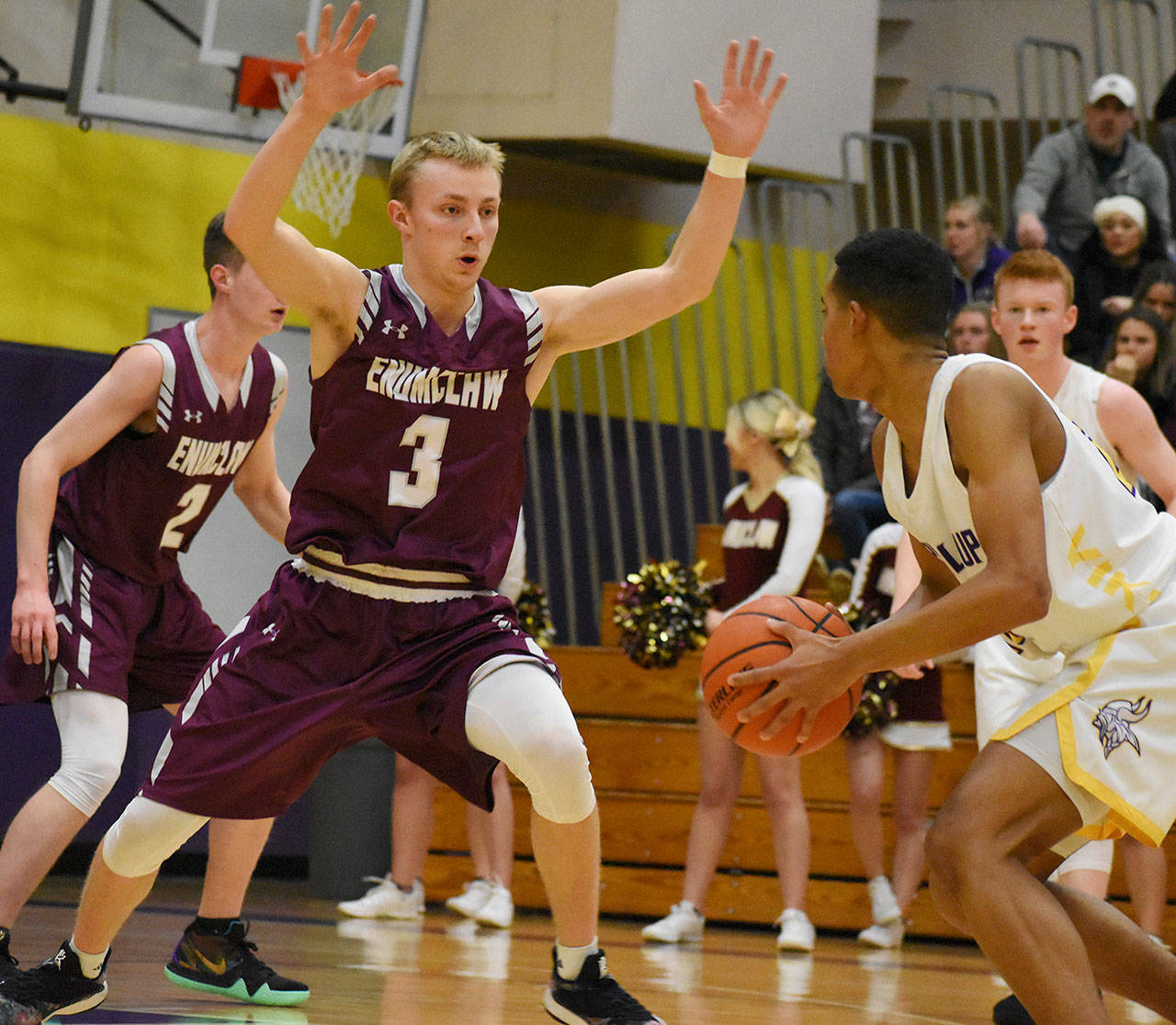 Enumclaw High senior Travis Smith and his Hornet teammates will be gunning for a return trip to the Class 4A state tournament. The first step on this weeks path was a Tuesday night, loser-out game against Rogers of Puyallup. Above, Smith defends during last weeks district loss at Puyallup High. Photo by Kevin Hanson