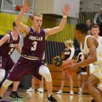 Enumclaw High senior Travis Smith and his Hornet teammates will be gunning for a return trip to the Class 4A state tournament. The first step on this weeks path was a Tuesday night, loser-out game against Rogers of Puyallup. Above, Smith defends during last weeks district loss at Puyallup High. Photo by Kevin Hanson