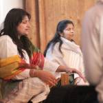 Lax Burt playing a shruti box and leading a practice chanting session with her sister, Abhliasha Iyer, before the Samsarafest 2018 Opening Ceremony. Photo by Ray Miller-Still
