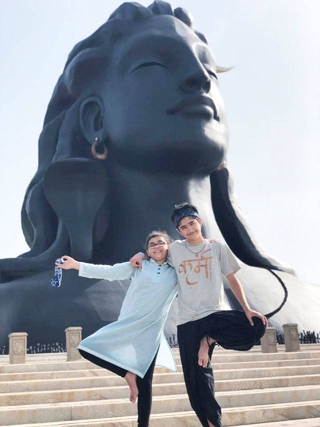 Areya and Rishi Burt will be teaching yoga classes at Samsarafest this year, since theyve completed their 200-hour training in India last summer. Here, they pose in front of Adi Yogi (first Yogi - Shiva) at Isha Ashram in Coimbatore, India after completing their teacher training program in Kerala. Submitted photo
