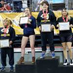 Following an athletic career at White River High, Tatiana Molinero-Ceras headed to Pacific Lutheran University. In her first year of collegiate wrestling, she placed fourth at the NCWA national championships. At left, she stands on the podium in Texas with the top-three placers; each was accorded All-American status. Submitted photo