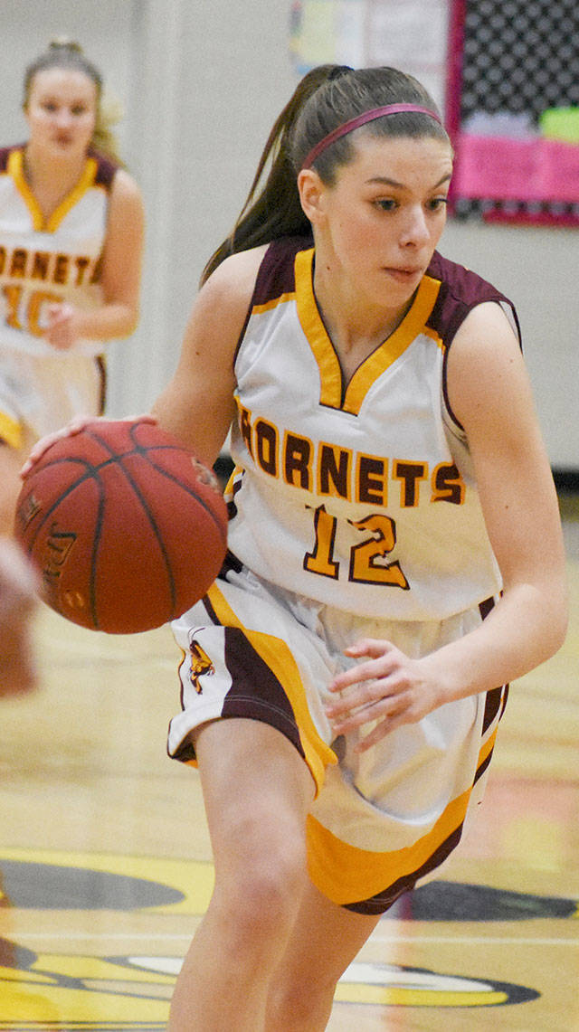 White Rivers Lee Audrey Norris (12) and Chloe Narolski (3) played in Seattle as part of the Senior All-State Games. File photos by Kevin Hanson