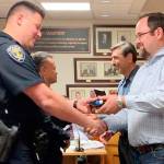 Officer Erik Vance receives his Life-Saving Award from City Councilman Chance La Fleur; in back, Officer Kim-Xaun Brewer is presented his award by Mayor Jan Molinaro. Contributed photo
