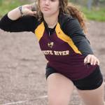 White Rivers Paidon Froemke prepares here to launch a second-place effort in the shot put; she won both the discus and javelin on Thursday. Photo by Kevin Hanson