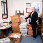 Sen. Maureen Walsh, R-College Place, poses with bins full of playing cards Wednesday that were sent to her by those upset with her remarks last week on the floor of the Senate. Staff estimates they have received over 1,700 decks of cards. Walsh has since apologized for her comments. Photo courtesy of the Washington State Legislature