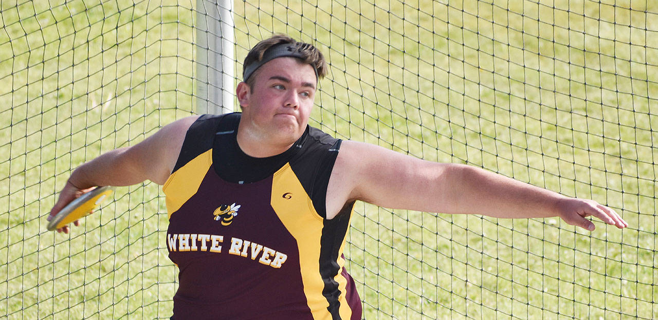 Jackson Gibbon prepares to release a winning toss in the discus during White Rivers home meet against Fife. Photo by Kevin Hanson