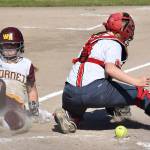 The White River girls advanced in the South Puget Sound League 2A softball tournament May 8 with a 6-4 victory over the Orting Cardinals. Above, Marissa Dolson slides safely into hone during a three-run inning. Photo by Kevin Hanson
