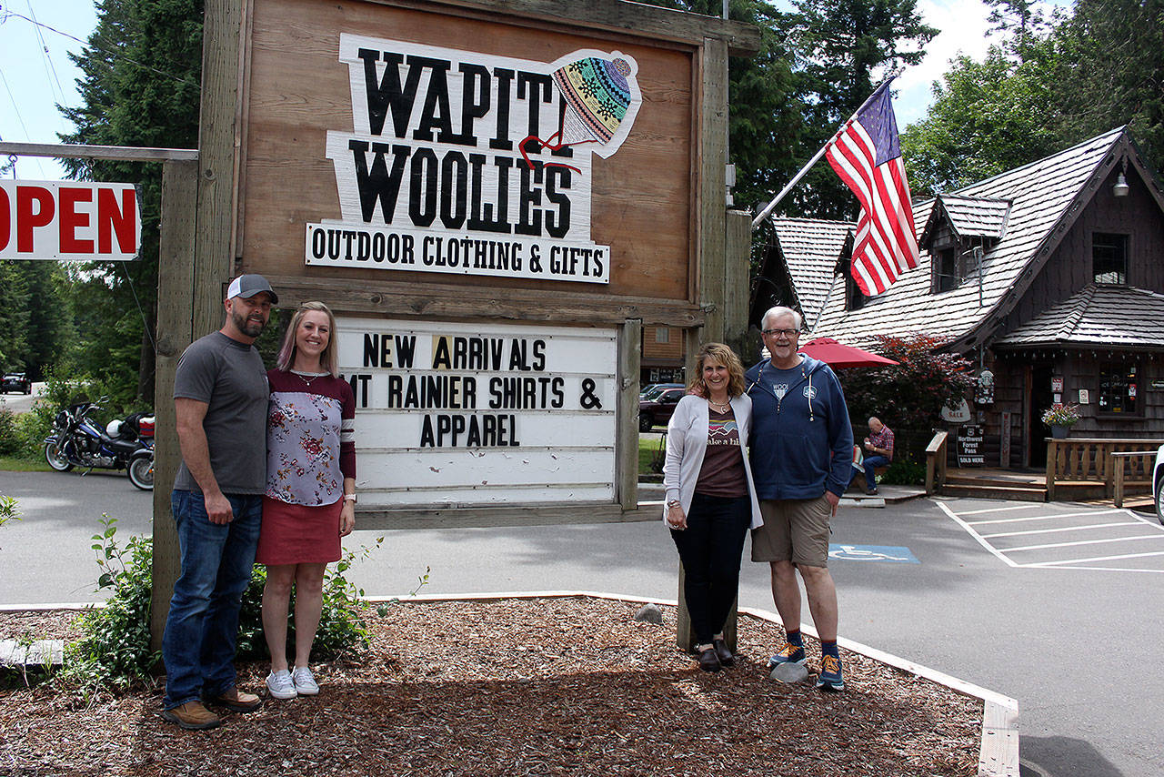 John and Karlyn Clark, left, are now the new owners of Wapiti Woolies in Greenwater. Right, Bob and Debbie Grubb, the previous owners, are helping the Clarks get acquainted with the business before going off to travel (though they promise to come back to the Plateau). Photo by Ray Miller-Still