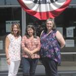 From left to right: Plateau Outreach Ministries Director Elaine Olson, Outreach Case Manager for Veterans and Seniors Lisa Napolitano, and Director Elisha Smith-Marshall stand outside of their nonprofits office. The trio work together regularly to help lift up the vulnerable populations in Enumclaw, Black Diamond and Covington.                                Photo by Danielle Chastaine