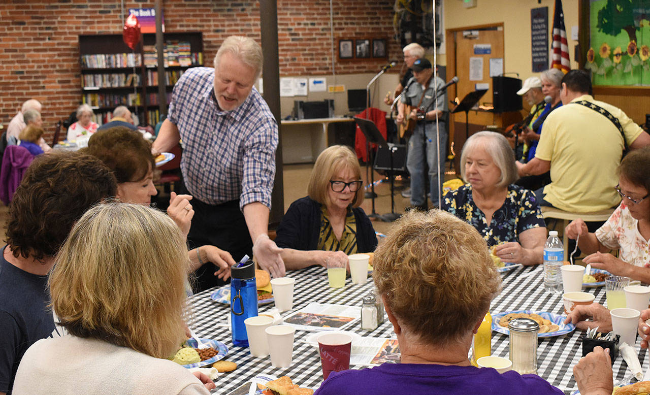 Trip Hart of SoHaPP fame serves seniors at the Enumclaw Senior Center during the annual Enumclaw Rotary picnic on Aug. 21. Photo by Kevin Hanson                                Trip Hart of SoHaPP fame serves seniors at the Enumclaw Senior Center during the annual Enumclaw Rotary picnic on Aug. 21. Photo by Kevin Hanson