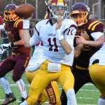 EHS quarterback Cameron Brauer prepares to deliver a pass during Fridays opening-night victory. Photo by Kevin Hanson