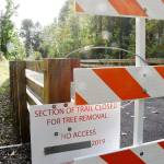 Pierce County has installed barricades at each end of the pin-pile bridge, hoping to keep Foothills Trail users away from a damaged section. Photo by Kevin Hanson