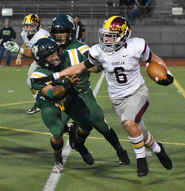 Enumclaw running back Jack McCann turns the corner and picks up yardage against Kentridge. Photo by Kevin Hanosn