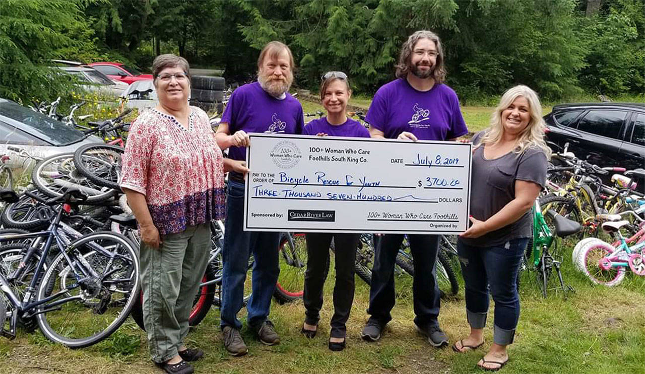 The South King Countys 100+ Women Who Care group presented Bicycle Rescue for Youth, a Ravensdale-based group, $3,800 at their last meeting. Pictures is Valerie Westover at the left, Bicycle Rescue board member Toni Culberson in the middle, and Nikki Westover at the right. Submitted photo