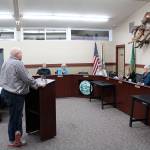 Councilman Patrick Nelson answering questions from the Black Diamond City Council before they left the room for an executive session and returning to unanimously confirm his appointment to the council. Photo by Ray Miller-Still